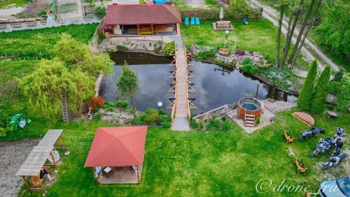 an aerial view of a miniature house and a pond at Gospodarstwo Agroturystyczne Pod Lasem Maria Płazio in Narol