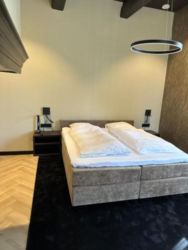 Katil atau katil-katil dalam bilik di Hotel Restaurant Het Witte Paard