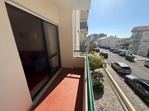 a balcony of a building with a view of a street at Rosário - two bedroom apart- Buarcos - Figueira da Foz in Figueira da Foz