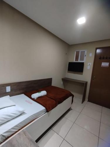 Ένα ή περισσότερα κρεβάτια σε δωμάτιο στο Sam House Hotel