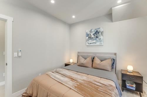a bedroom with a bed and two night stands at Sleek Ferndale Home with Ocean and Mountain Views! in Ferndale