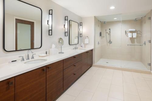 a bathroom with two sinks and a shower at Sheraton Puerto Rico Resort & Casino in San Juan