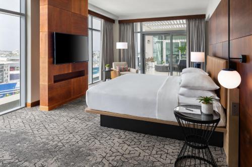 a hotel room with a bed and a television at Sheraton Puerto Rico Resort & Casino in San Juan