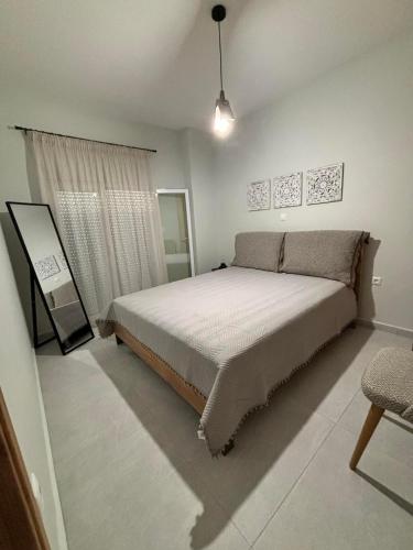 a bedroom with a large bed in a room at ΚΟΧΥΛΙ in Ierissos