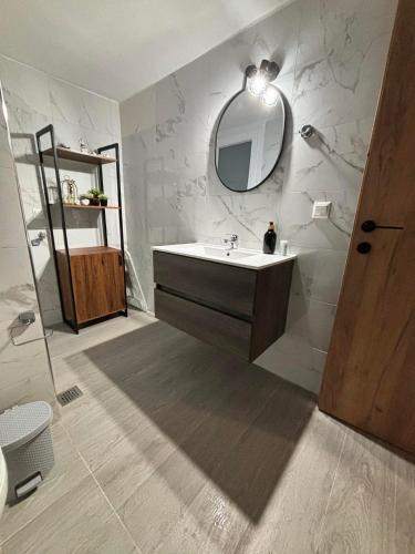 a bathroom with a sink and a mirror at ΚΟΧΥΛΙ in Ierissos