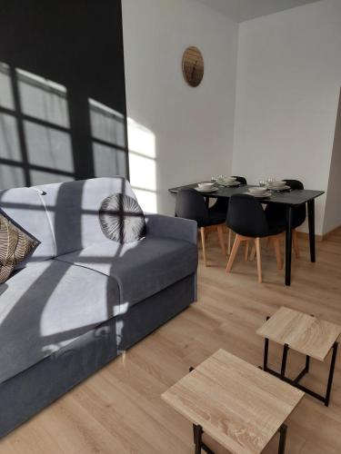 Ruang duduk di Appartements L'hirondelle