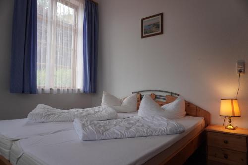 Katil atau katil-katil dalam bilik di Alcor Hotel Feriendorf an der Ostsee