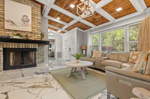 a living room with a couch and a fireplace at Serenity Haven Luxe Pet Friendly 5BR With Pool in Clearwater