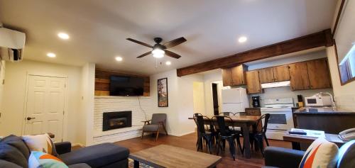 a living room with a kitchen and a dining room at Eagle Cap Chalets in Joseph