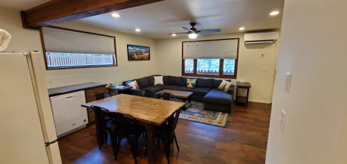 a living room with a couch and a table at Eagle Cap Chalets in Joseph