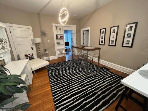 a living room with a black and white rug at 2 BR Totally Renovated and Chic in Columbus