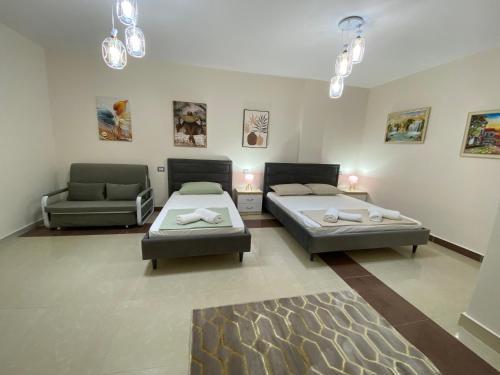 Postel nebo postele na pokoji v ubytování Tinas Rooms