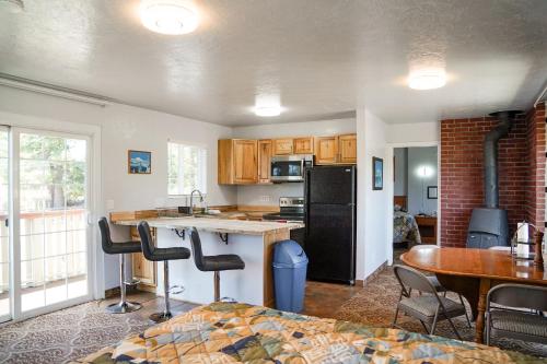 a kitchen with a sink and a counter top at Swiss Holiday Lodge in Mount Shasta