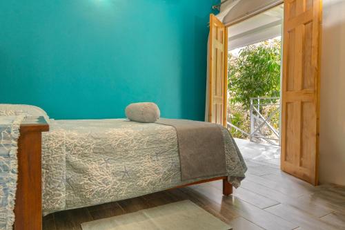 Ένα ή περισσότερα κρεβάτια σε δωμάτιο στο Casa Choucoune