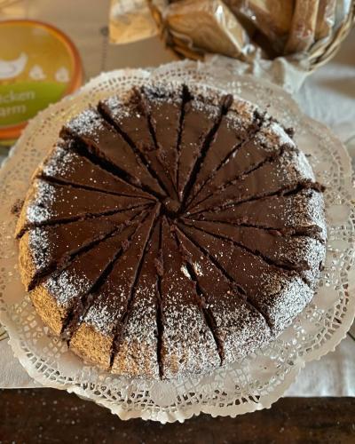 a chocolate cake on a plate on a table at La valle incantata in Villanova dʼAsti