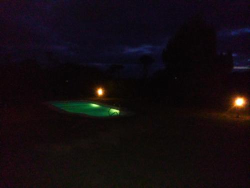 a car parked in the dark at night at Hotel El Refugio nudista naturista opcional in Chihuahua