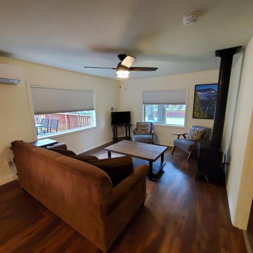 a living room with a couch and a table at Eagle Cap Chalets in Joseph