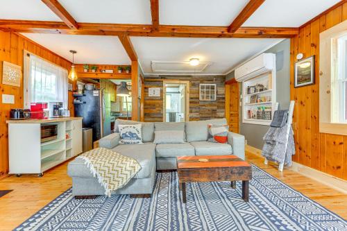 a living room with a couch and a table at Pet-Friendly Wilmington Retreat with Hot Tub! in Wilmington