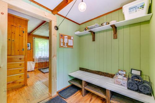 a room with green walls and a bench in it at Pet-Friendly Wilmington Retreat with Hot Tub! in Wilmington