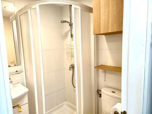 a small bathroom with a shower and a toilet at Apartamento TORRESOL NSFA - TORRECILLA, NERJA - studio in Nerja