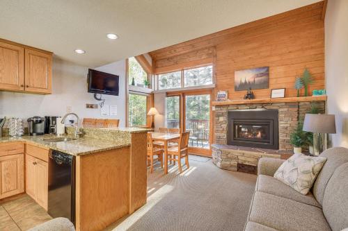 a kitchen and living room with a fireplace at Cozy Alpine Escape Ski-InandOut at Lutsen Mtns in Lutsen