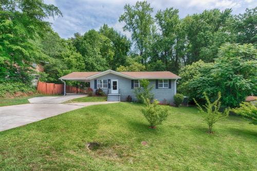 a small house in a yard with a driveway at The Creek House in Marietta