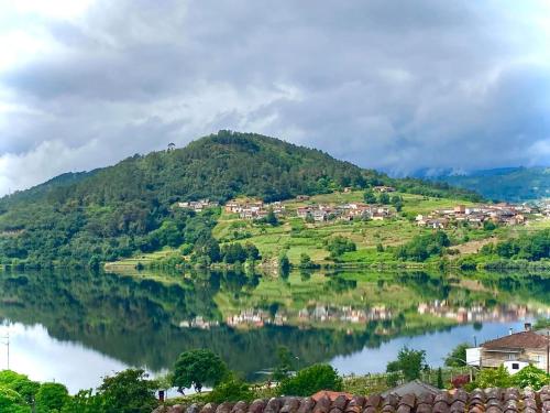 a small village on a hill next to a lake at Forxa, Ventosela in Ventosela