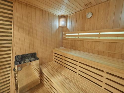 a wooden sauna with a clock on the wall at Hotel Ca'l Bisbe in Sóller