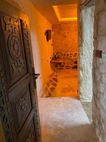 an open door in a room with a hallway at Ashab-I Kehf Cappadocia House in Nevsehir