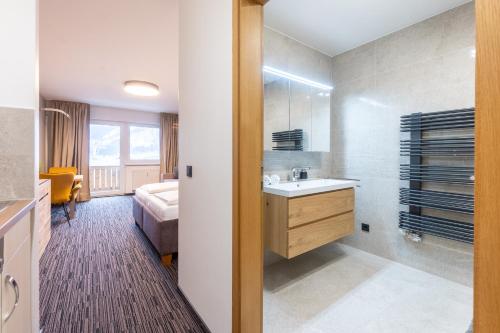 Katil atau katil-katil dalam bilik di Praga Apartments & Restaurant Zell am See-Kaprun