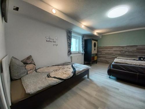a bedroom with a bed in the corner of a room at Ferienwohnung Witting in Wenns