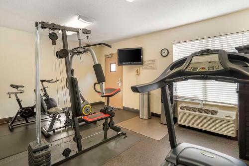 a gym with two exercise bikes and a treadmill at Best Western Carowinds in Fort Mill