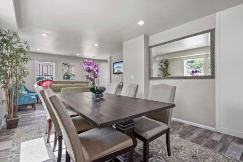 a dining room with a wooden table and chairs at Spacious family Guesthouse private entry near six flags in Santa Clarita