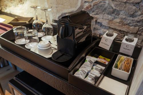 a wooden drawer with items on top of a table at Cartesiano Boutique & Wellness Hotel in Puebla