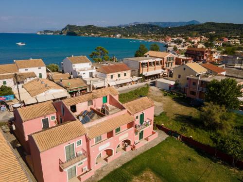 an aerial view of a town next to the water at Alexandra's Apartments in Sidari