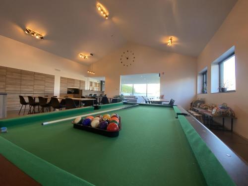 a large billiard room with a pool table at Villa Mareon in Schorisse