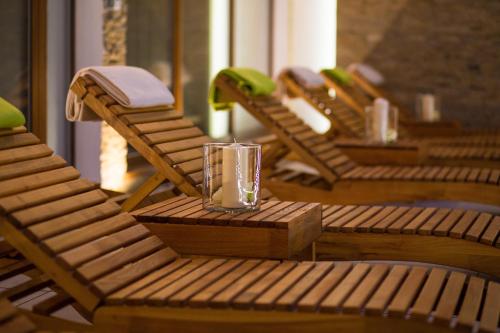 a glass sitting on top of a row of chairs at Hotel DARO in Banská Štiavnica