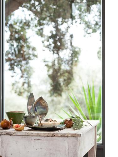 a table with a plate of food on a window at Agriturismo Petrara in Simeri