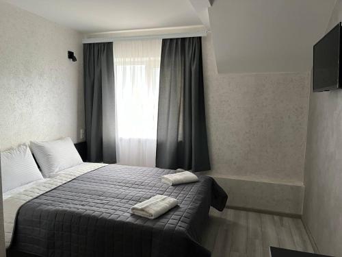 Postel nebo postele na pokoji v ubytování Sadyba Magnat Hotel