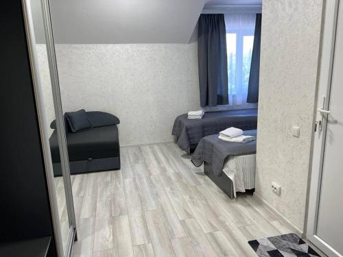 Postel nebo postele na pokoji v ubytování Sadyba Magnat Hotel