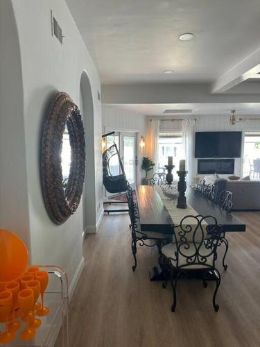 a living room with a table and chairs and a bed at The Most Desired Summer Retreat with Private Pool Just 5 Minutes from the Beach in Spring Lake