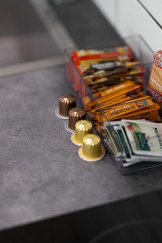 a table with some chocolates and some magazines at Seahaven Resort in Townsville