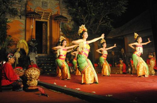 a group of women dancing on a stage at Villa SARY AKAR in Payangan