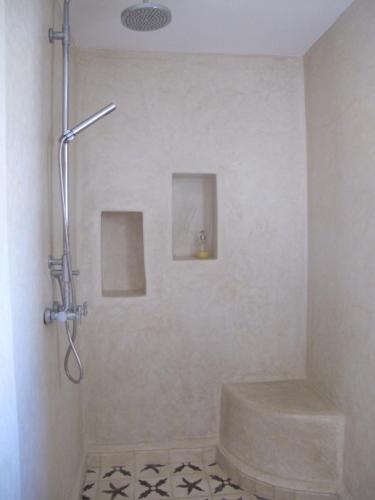 a bathroom with a shower with a toilet at Dar Alya Essaouira Maison et table d'hôtes in Ghazoua
