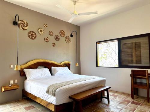 a bedroom with a large bed and a window at Casa Chiquilluma in Piedra Blanca