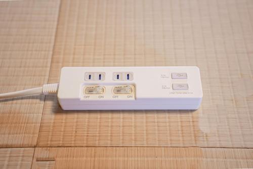 a remote control sitting on top of a table at FUJIクロスゲートハウス in Fujiyoshida