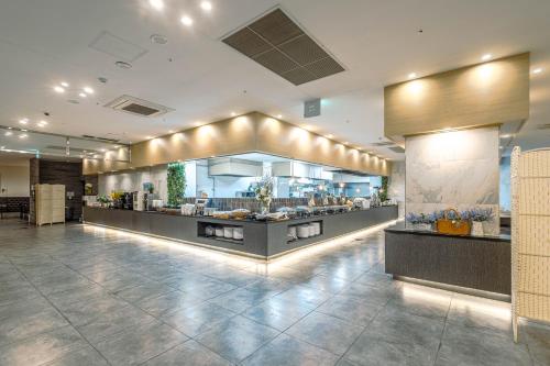a restaurant with a buffet in the middle of a room at JK Blossom Hotel in Seoul