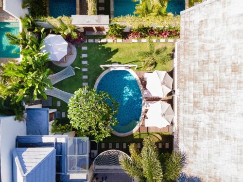 an overhead view of a pool at a resort at Aeera Villa Canggu by Ini Vie Hospitality in Canggu