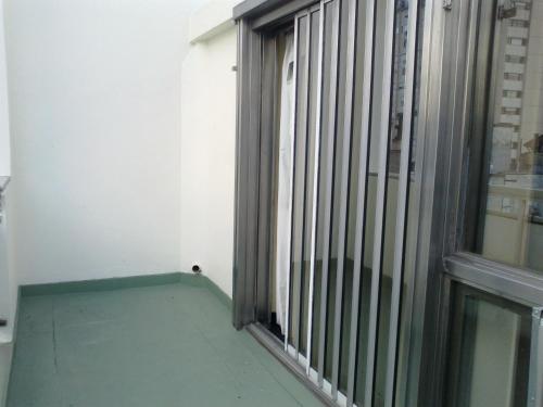 a room with a window with bars on it at Tritone Hotel in Buenos Aires