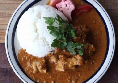 a bowl of food with meat and rice on a table at Koyado Enn in Toyooka